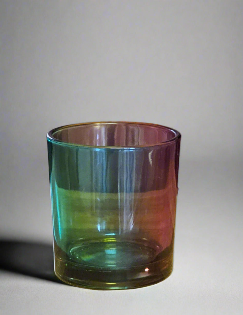 a colorful glass sitting on top of a table